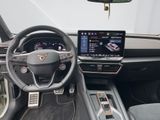 the interior of a car with a steering wheel, dashboard, and a touch screen