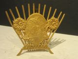 a gold plate with a picture of a woman on it
