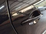 a close up of a door handle on a car