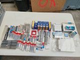 a lot of pens and other items on a table