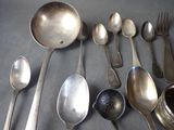 a lot of spoons and spoon spoons on the table