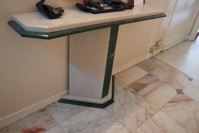 a table with a phone on it in a room