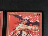 two cards on the table with a picture of a woman holding a bat