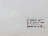 a white box with a red and black sign on it