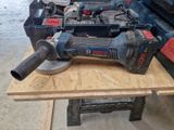 a picture of a corded sander and other tools on a workbench