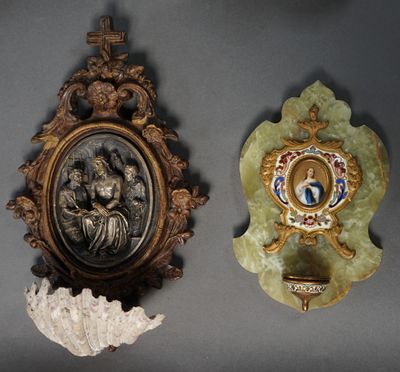 two wall plaques with a picture of a woman and a man in a gold frame