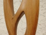 a wooden sculpture of a fish on a stand