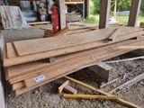 several pieces of wood are stacked on top of each other in a garage