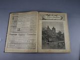 an old book with a picture of a town on it