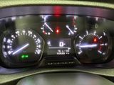 a close up of a car dashboard with various gauges