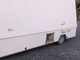 a white truck that is parked on the side of the road