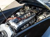 a close up of a car engine with its hood open