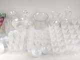 a lot of empty glassware sitting on a table