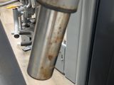 a close up of a metal pipe on a bike
