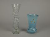 two vases sitting next to each other on a table