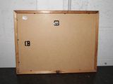 a picture of a wooden box on a black floor