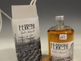 a bottle of ferroni next to a box of coffee