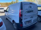 a white van that is parked in a parking lot