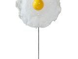 an image of a sculpture of an egg on a stand