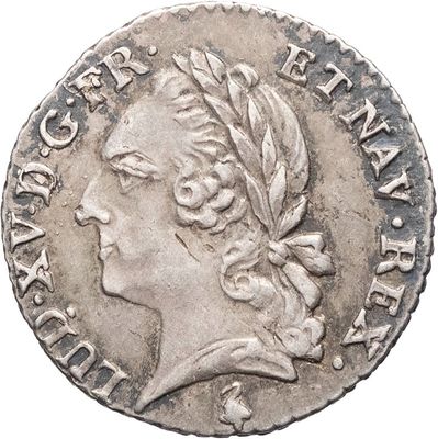 une pièce en argent avec l'image d'une femme de profil
