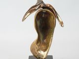bronze sculpture of a woman ' s head on a marble base