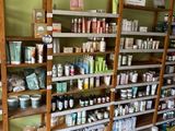 many shelves that have various items on them in a store