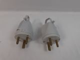 pair of white electrical plugs on a white surface with a white background