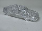 a clear toy car that is sitting on a table