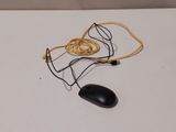 a computer mouse and a cord on a table