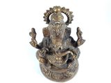 a statue of an elephant sitting on top of a table