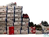 a pile of shoes that are stacked on top of each other