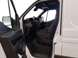 a white van with the door open and the driver ' s seat down