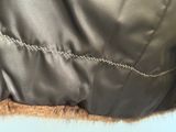 a close up of a jacket with a chain on it