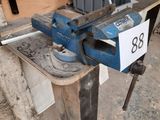a viset on a workbench with a number on it