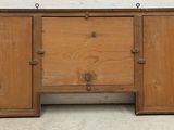 an image of a wooden cabinet with two doors open