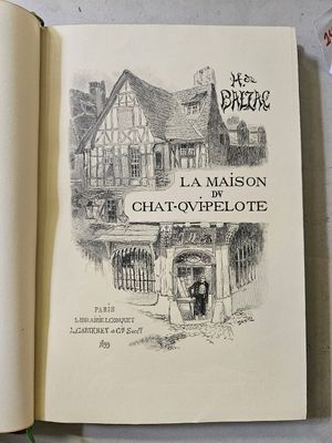 un livre ouvert sur lequel est dessiné une maison