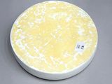 a white plate with a yellow and white design on it