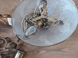 a silver plate with a clock on it and a pair of scissors next to it