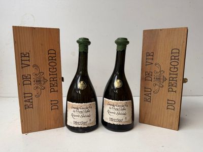 two bottles of wine are sitting next to a wooden box