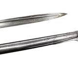 two swords that are on display on a white background