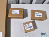three boxes are sitting on top of a table with a barcode on them