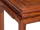 the table is made of wood and has a square top