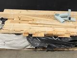 a pile of wood sitting on top of a pallet