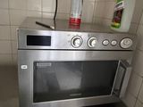 a microwave sitting on top of a counter in a kitchen