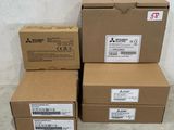 three boxes are stacked on top of each other on a tile floor