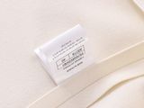 the label on the back of a white shirt