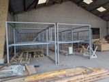 a large warehouse with a lot of wooden pallets in it