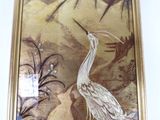 a picture of a painting of a bird on the wall