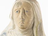 a statue of a woman with a veil on her head
