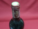 a bottle of wine that is sitting on a table